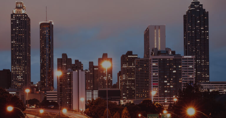 city with tall buildings at evening